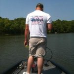 Grant wearing his new Stokley's tee shirt on their new Tracker boat